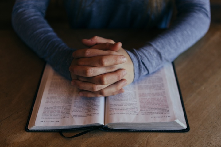 A person reading a Bible.