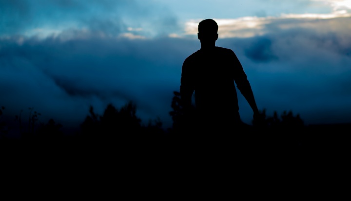 A silhouette of young man.