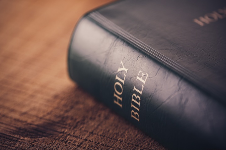 A Bible laying on a table.