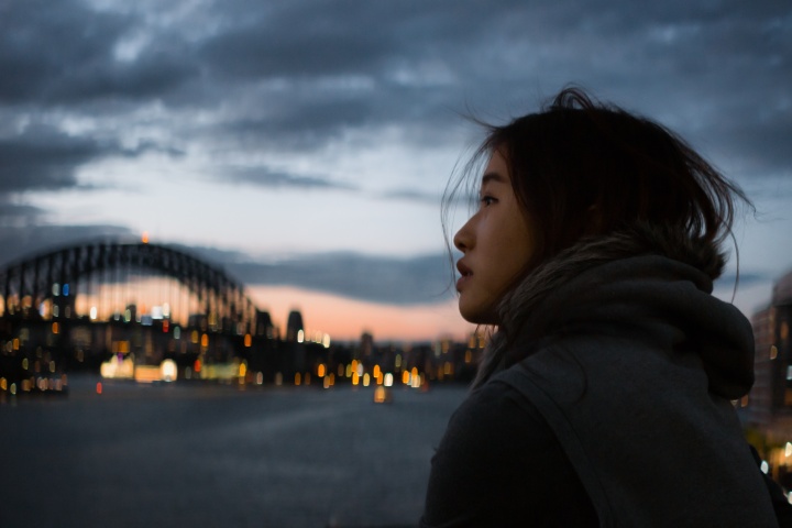 A woman looking up at the sky.