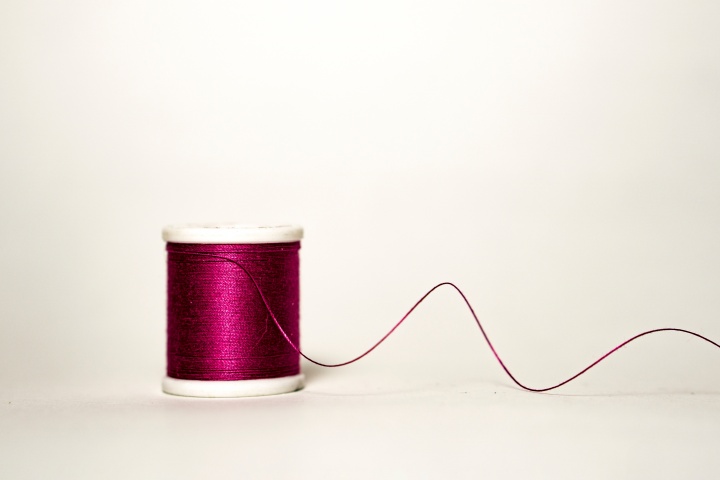A spool of thread unraveling.