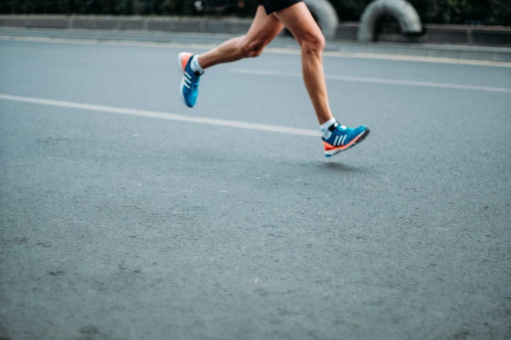 You Can Be a Successful Runner, a cropped image of a man's legs running on pavement