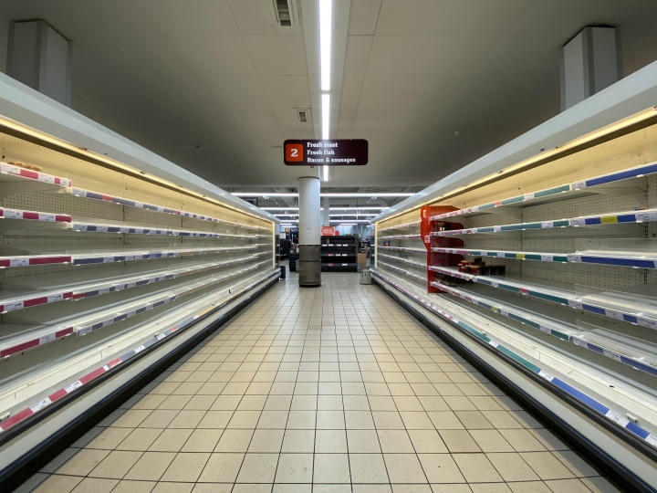 Empty grocery store shelves.