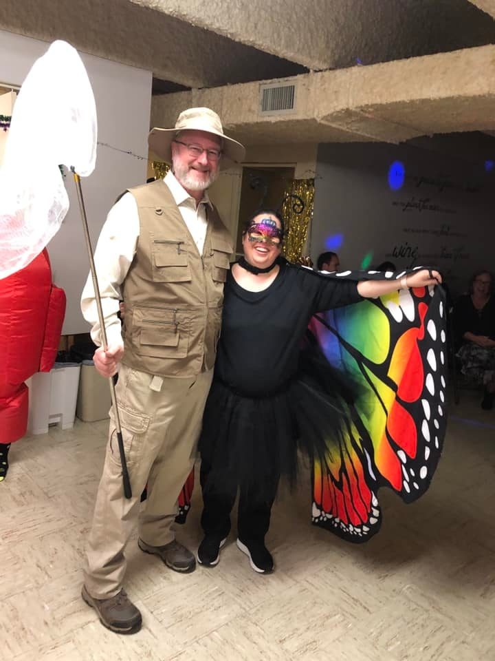 A couple dressed in butterfly-themed costumes
