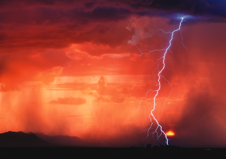 A storm with clouds, rain and lightning. 