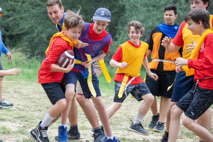 a group of boys playing with a football