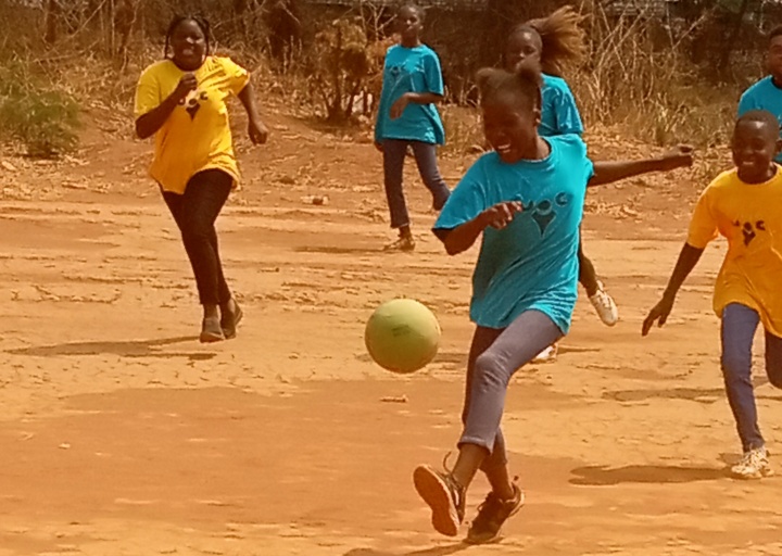 a group of girls playing sports outside