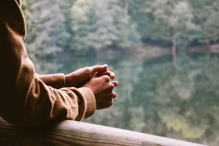 Privately praying in a serene outdoor setting
