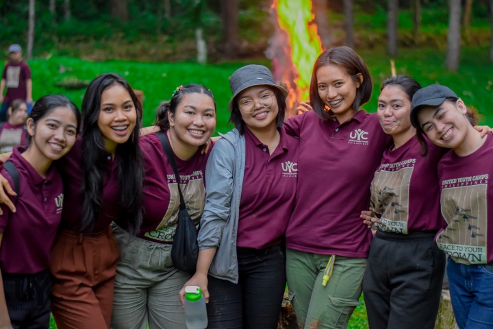 a group of female campers wearing matching shirts
