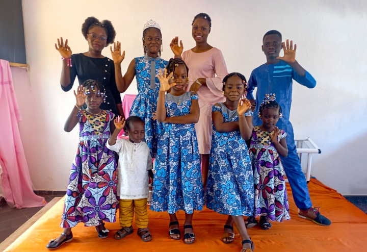 a group of children waving