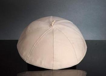White papal zucchetto worn by the Pope.