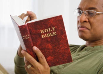 Man reading the Bible.