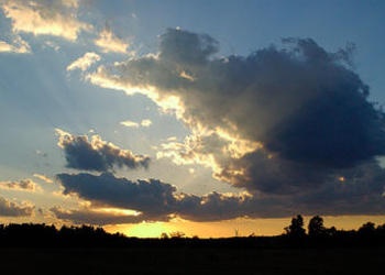 Sunset behind the clouds.