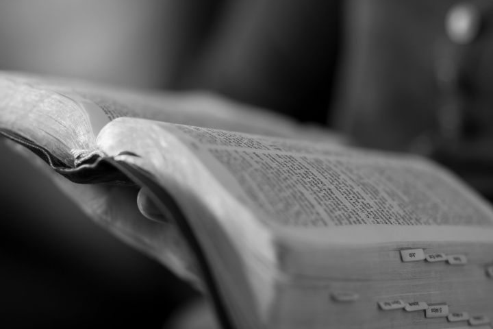 A women reading a Bible.