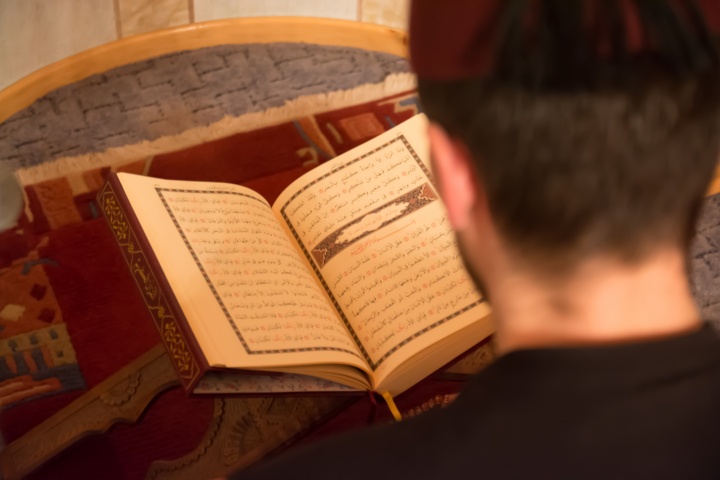 Man reading the Koran