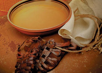 Water basin and pair of sandals.