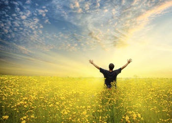 A man raising his hands to the sky.