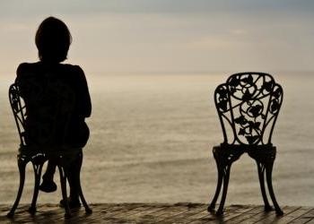 Woman and empty chair - In the Shadow of Death