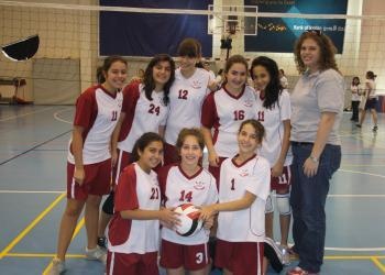 stella helterbrand with the volleyball team she coached in Jordan