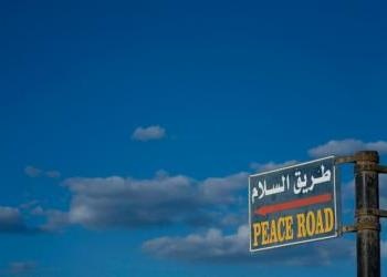 Sky and road sign "peace road" in english - When Will Peace Come to 
