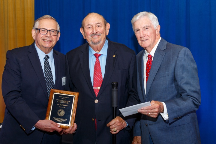 Top: Victor Kubik and Dr. Donald Ward recognize earl Roemer for 50 years of service in the ministry.