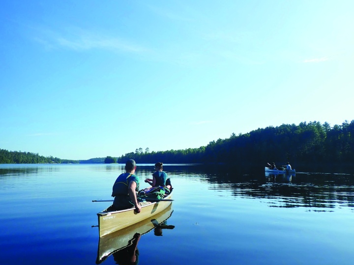 Photo of campers canoeing during the Boundary Waters adventure.