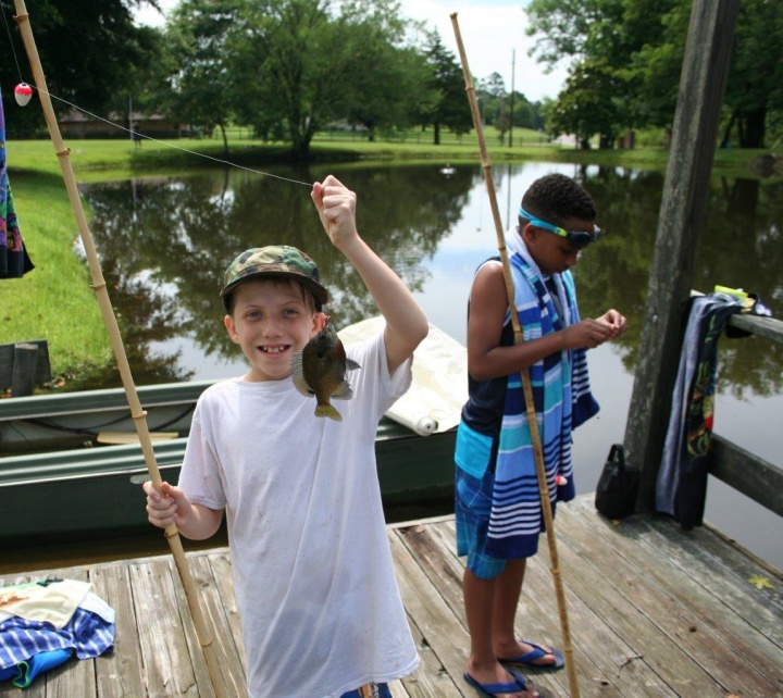 Fishing at Piney Woods preteen camp.