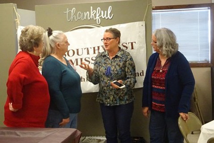 Photo of four women fellowshipping at the Missouri Women's Enrichment Weekend.