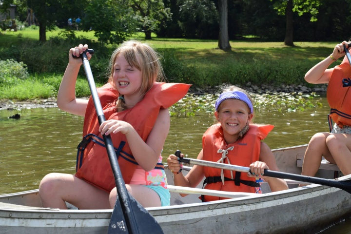 Campers enjoying the rowboat activity.