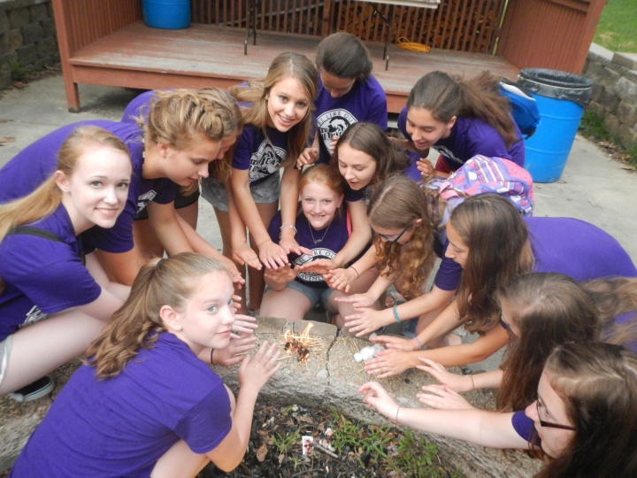 A girls' dorm started their own fire as part of the Amazing race activity at Camp Pinecrest. 