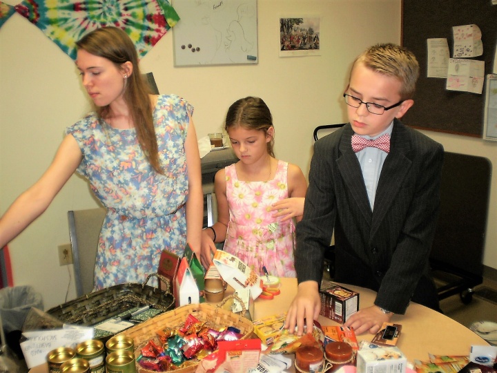 Youth from the Charlotte, North, Carolina congregation work hard at filling gift baskets for local shut ins. These baskets were delivered before the Feast. 