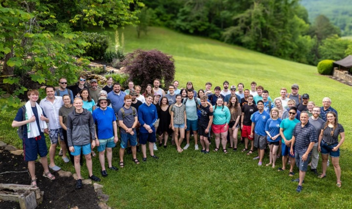 a large group of young adults standing outside