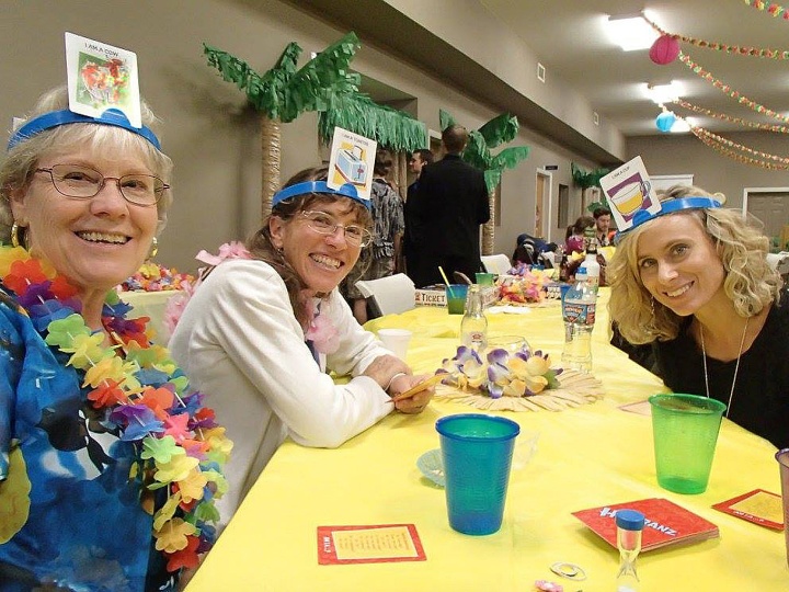 Left to right: Diane Oliver, Berenice Emehiser and Becky Oliver enjoy a game of Headbanz at the Luau.