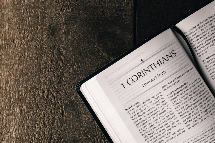 a Bible open to the book of 1 Corinthians