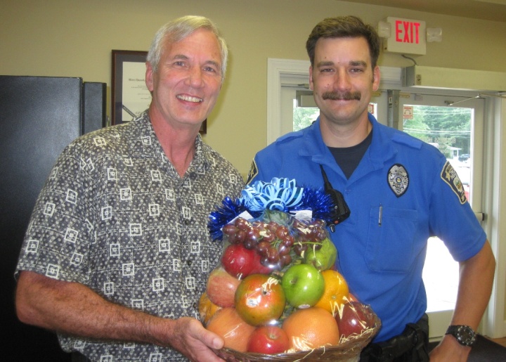 Richard Kennebeck shares a fruit basket with the local police department. 