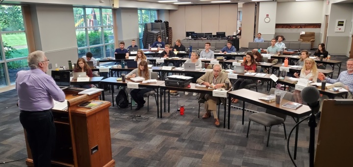 Photo of Scott Ashley addressing the ABC Class of 2021 in the lecture hall of the home office.