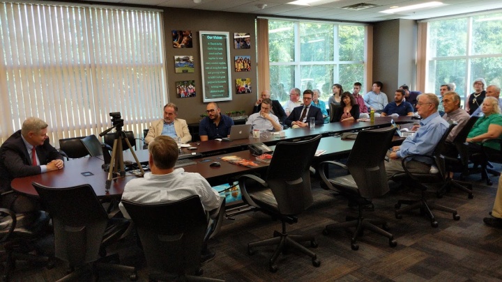 David Caudill speaking to the home office staff. 