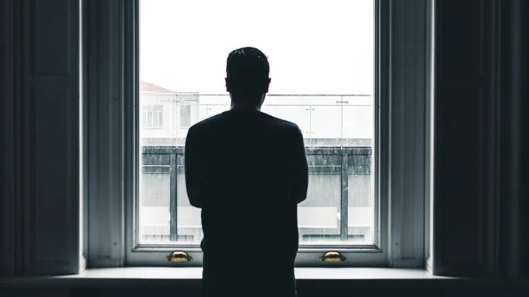 Overcoming an addiction or sinful behavior requires a change in the way you think. Since your mind has been corrupted, it needs a transformation. A man looking out a window.